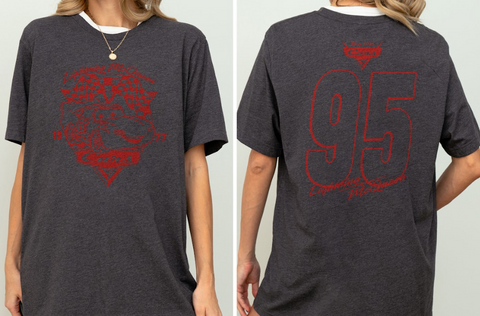 a person wearing a gray t-shirt with a red graphic design on the front and the number 95 on the back.