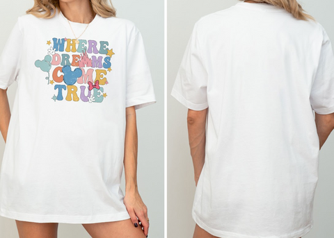 A white t-shirt with a colorful graphic design featuring the text "WHERE DREAMS COME TRUE" and a Mickey Mouse character.