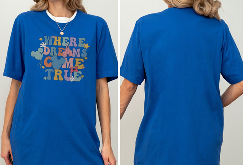 A woman wearing a blue t-shirt with the text "WHERE DREAMS COME TRUE" printed on it.