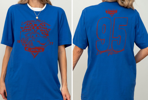 A person wearing a blue t-shirt with a graphic design and text on the front and back.