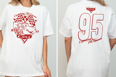 A white t-shirt with a red graphic design featuring a car and the text "Lightning McQueen" and "77" printed on it.