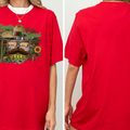The image is a collage of two photos of a red t-shirt. The left photo shows the front of the t-shirt with a graphic design featuring a cowboy hat, a cactus, and a sunflower. The right photo shows the back of the t-shirt, which is plain and red.