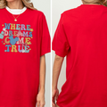 A red t-shirt with a colorful graphic and text on it.
