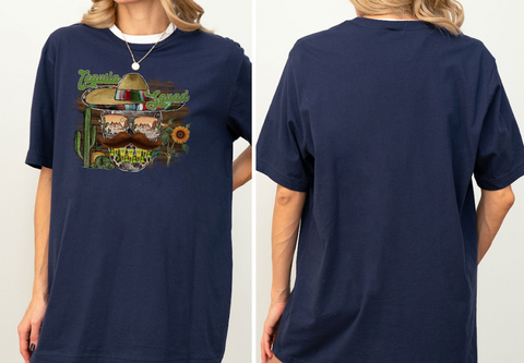 A woman wearing a navy blue t-shirt with a graphic design featuring a sombrero, cactus, and sunflowers.