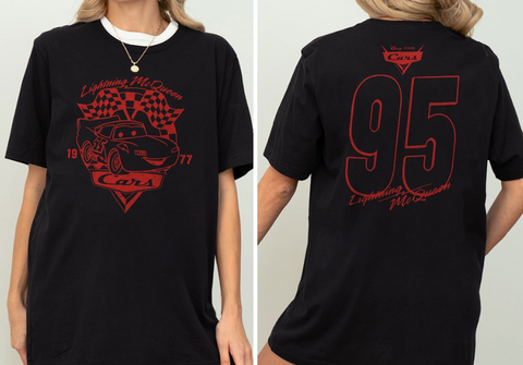 A black t-shirt with a red graphic design featuring a car and the text "Lightning McQueen" and "77" printed on it.