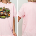 A woman wearing a pink t-shirt with a graphic design featuring a sombrero, cactus, sunflower, and other Mexican-themed elements.