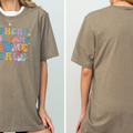 The image is a collage of two photos of a woman wearing a gray t-shirt with a colorful graphic design.