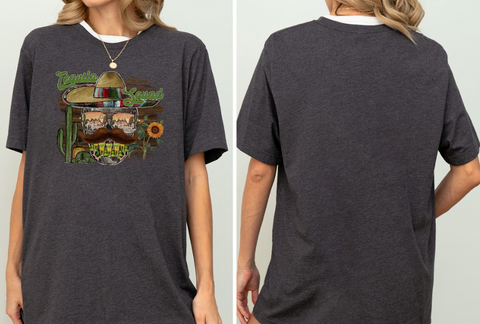 a woman wearing a t - shirt with a picture of a skateboarder on